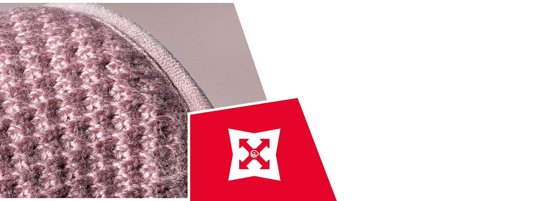 Gros plan sur un tissu en laine tricotée rose et grise, montrant la texture et les mailles détaillées. Une icône rouge représente un bouclier blanc avec des flèches, symbolisant la durabilité ou la résistance.